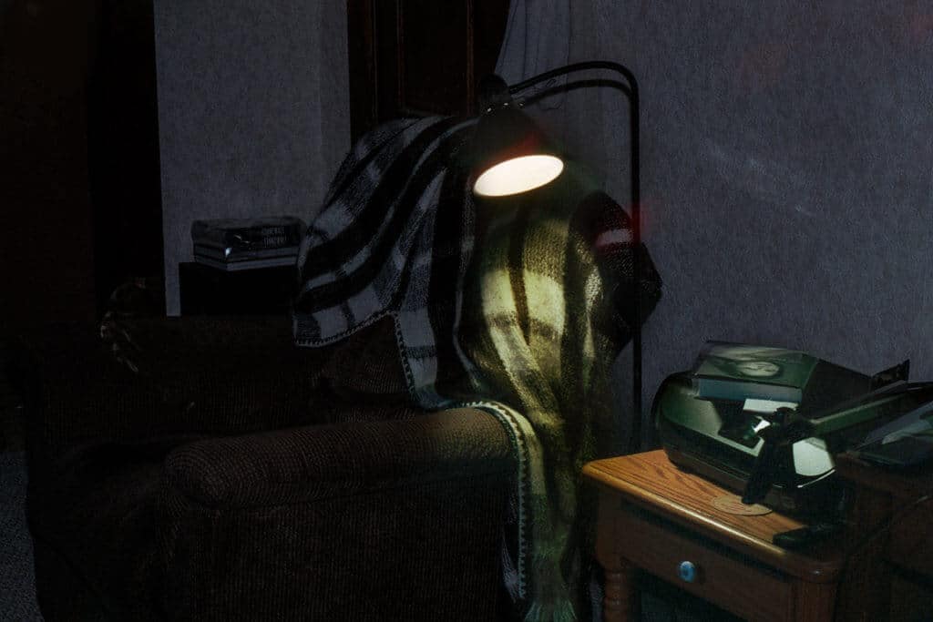 Sofa lit by lamplight